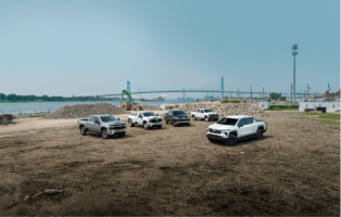 An exterior shot of two Ford trucks