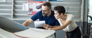 Woman talking to auto insurance adjuster